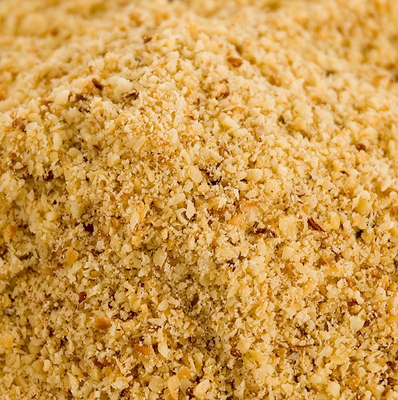 A close-up image of a 1 kg package of dark, roasted, coarse hazelnut semolina