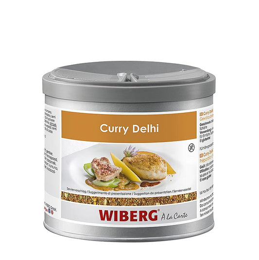 Wiberg Curry Delhi Style, grob, würzig/fruchtig, 280 g, showing the vibrant yellow spice blend in a clear glass jar with a red and gold label