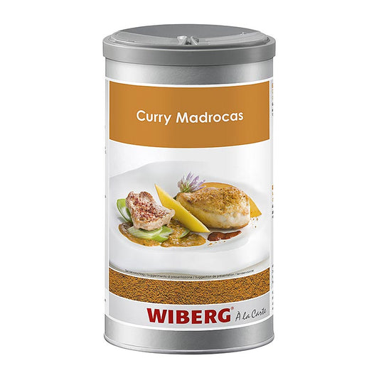 Close-up image of Wiberg Curry Madrocas Gewürzmischung, a 560 g spice mix in a yellow and red packaging, ideal for adding flavor to dishes (English)