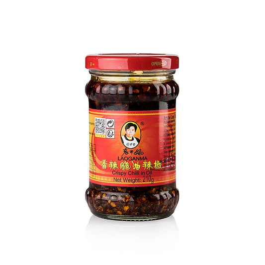 Alt text: A 210g jar of Lao Gan Ma Crispy Chili Oil with whole chilies in oil and crispy onions, a popular Chinese condiment 

Language: English